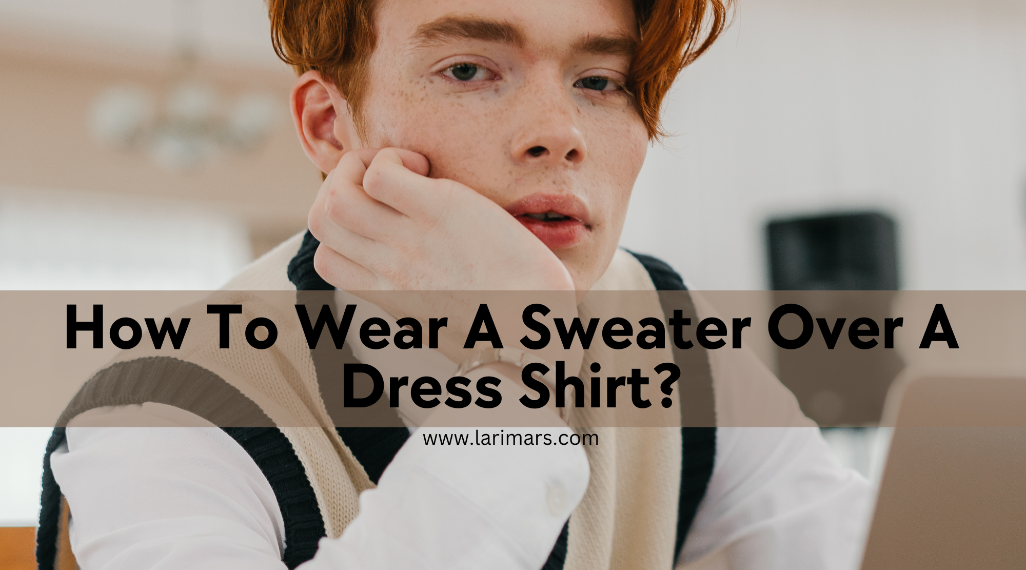 Young boy wearing sweater over dress shirt
